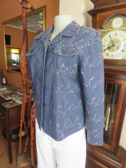 One of a kind!!Boutique made blue denim jacket in size 36/12.Yoked back and front.New condition.