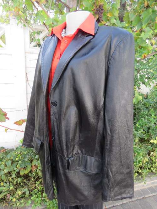 Fabulous black genuine leather ladies long jacket by 'DONNA CLAIRE' in size 44/20.As new.