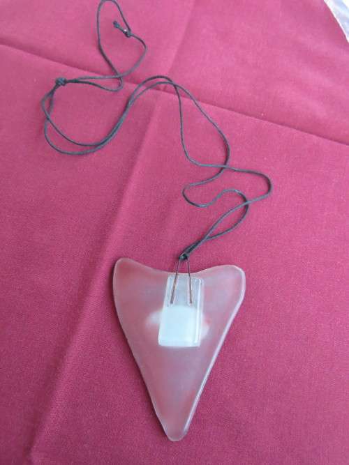 Heart shaped resin necklace with black cord.Good condition.