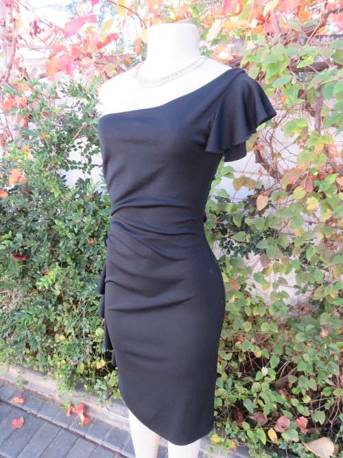 Sexy black one shoulder evening dress in 100% stretch polyester.Size 34/10 by 'RUBY ROX'.As new.