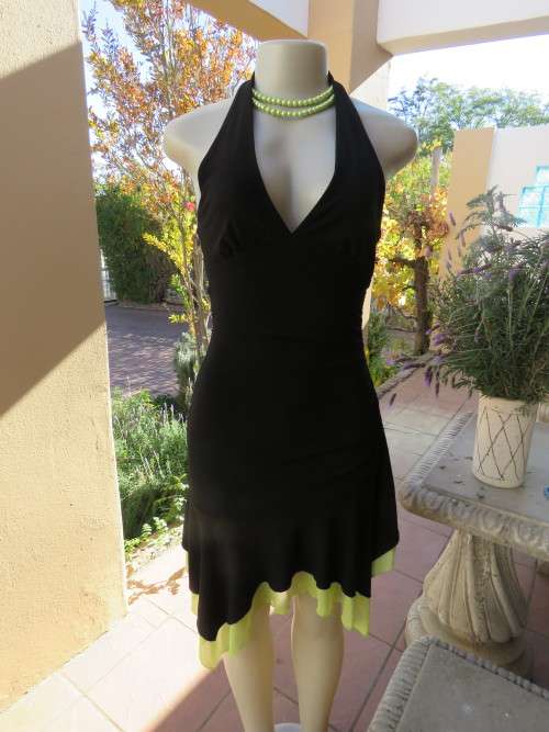 Chic black 'XOXO' evening dress in size 34/10.Made in U.S.a.In 100% stretch polyester.As new.