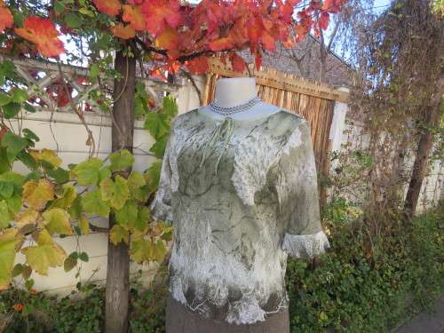 Glam top by 'WINDEL' in white and olive green with long short sleeves.Size 36/12.New condition.