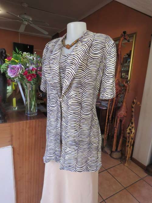 Animal print 2 piece top in beige/brown.Size 38/14 by 'RHAPSODY'.New condition.