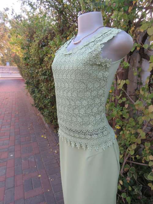 Knock out sleeveless lace top in apple green. Cami style in 32/8 with stretch polyester back/lining.