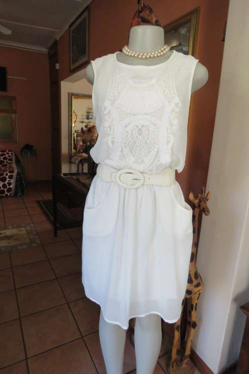 Classy soft cream colour dress in sheer polyester with lining in size 37/13 by  TRUWORTHS. As new.