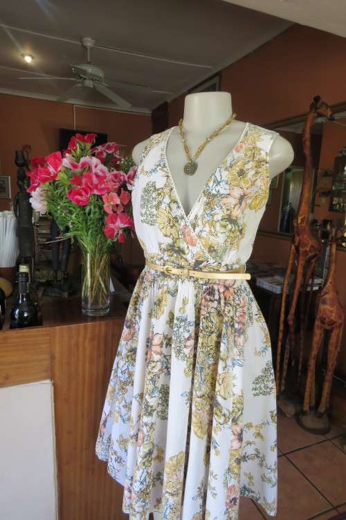 Used cotton dress in cream with bold crimson and mustard colour Flowers. Cross over bust. Size 40/16