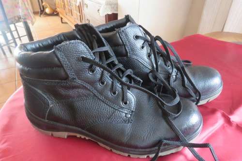 Pair of black Men's 'Adventure' shoes in size 10. Oil and acid resistant soles. Leather uppers.