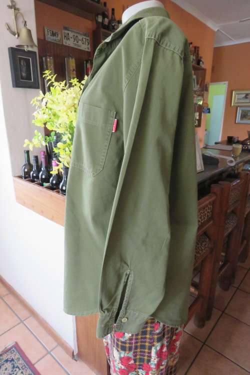 Army green ladies long sleeve casual shirt by 'News' in size 40/16. Two front pockets.