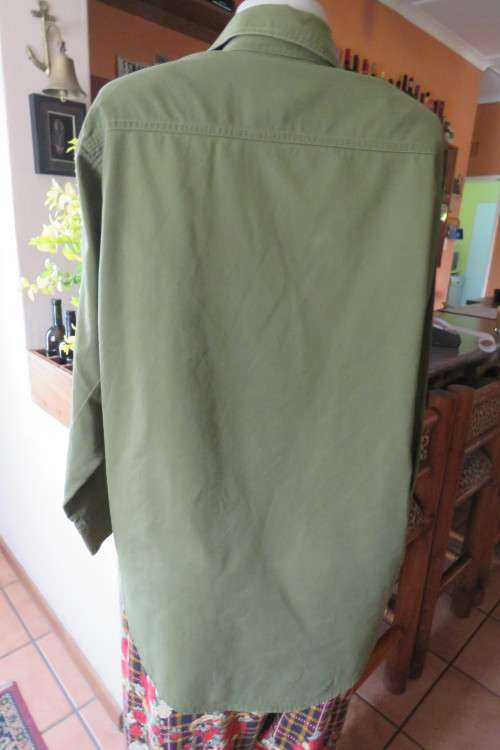 Army green ladies long sleeve casual shirt by 'News' in size 40/16. Two front pockets.