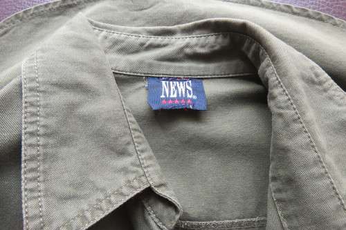 Army green ladies long sleeve casual shirt by 'News' in size 40/16. Two front pockets.