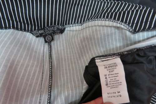 Show stopping low rise black and white striped pants with wide waistband. Size 36/12.