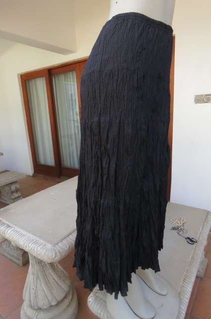 Black long skirt in creased polycotton by 'Edge' in size 36/12. With elasticated waist.