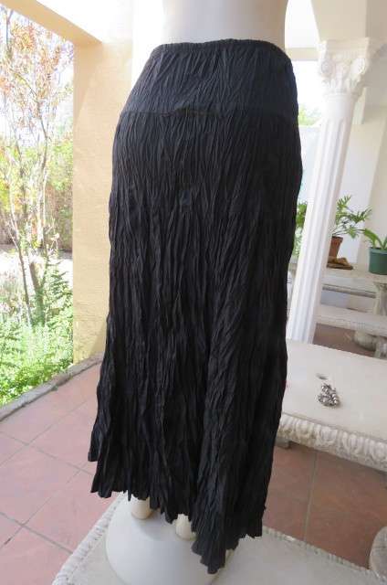Black long skirt in creased polycotton by 'Edge' in size 36/12. With elasticated waist.