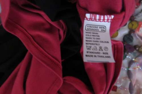 Strapless top in stretch viscose fabric size 34/10. Magenta pink top and seam with black middle area