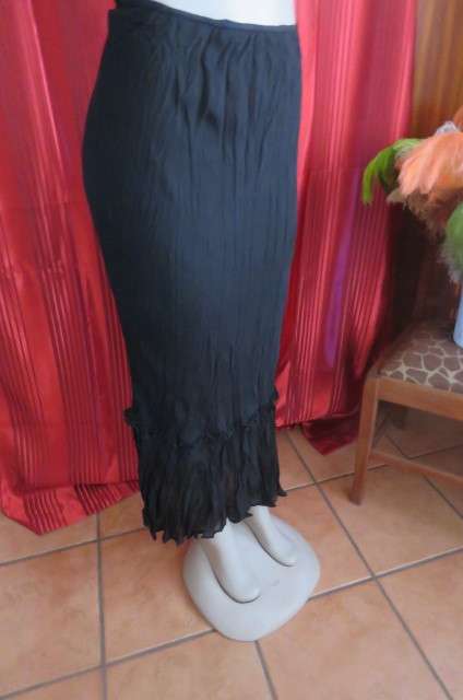 Floor length black crinkled polyester, fully lined skirt in size 32/8 by `Sassi`. Elasticated waist.