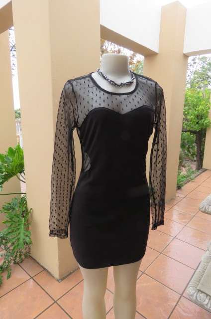 That little black dress! By 'Miss L' in size 38/14 fit size 36/12 good tight fit. Round neckline.