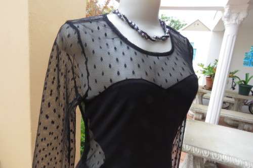 That little black dress! By 'Miss L' in size 38/14 fit size 36/12 good tight fit. Round neckline.