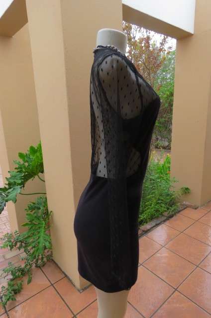 That little black dress! By 'Miss L' in size 38/14 fit size 36/12 good tight fit. Round neckline.