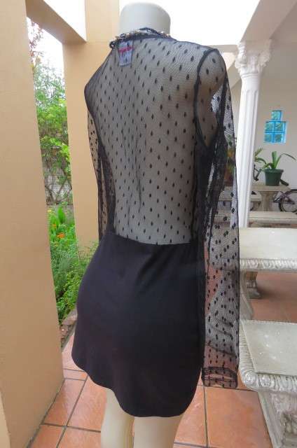 That little black dress! By 'Miss L' in size 38/14 fit size 36/12 good tight fit. Round neckline.