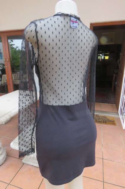 That little black dress! By 'Miss L' in size 38/14 fit size 36/12 good tight fit. Round neckline.