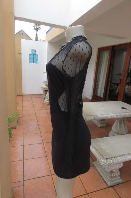 That little black dress! By 'Miss L' in size 38/14 fit size 36/12 good tight fit. Round neckline.