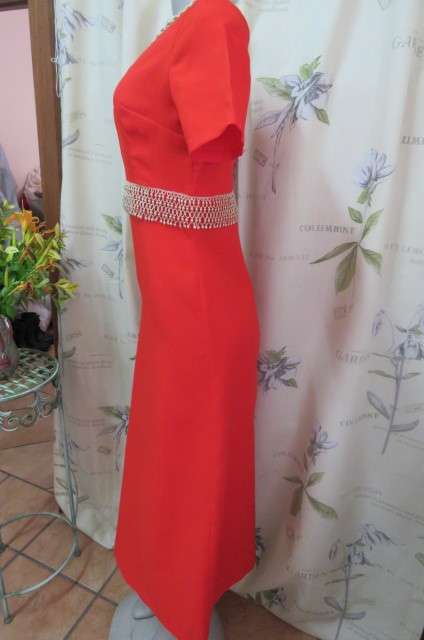 Attractive red maxi owner made empire style dress with short sleeves size 32/8. Very good cond.