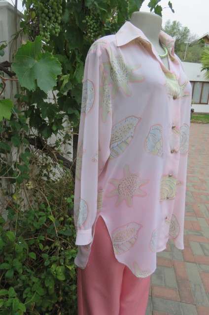 Sheer polyester long sleeve top in pale peach colour. Size 38/14 by 'Giorgio'. Cuffed sleeves.