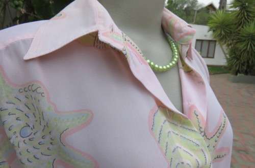 Sheer polyester long sleeve top in pale peach colour. Size 38/14 by 'Giorgio'. Cuffed sleeves.