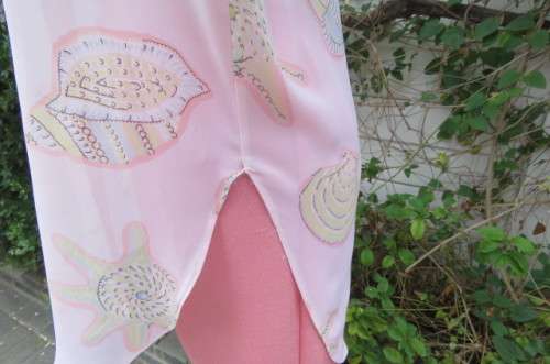 Sheer polyester long sleeve top in pale peach colour. Size 38/14 by 'Giorgio'. Cuffed sleeves.