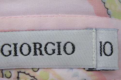 Sheer polyester long sleeve top in pale peach colour. Size 38/14 by 'Giorgio'. Cuffed sleeves.