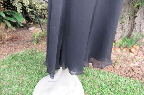 You can pair this smart black A-line skirt in 2 layers with a range of matching tops size 36/12.