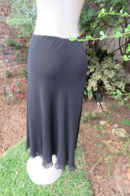 You can pair this smart black A-line skirt in 2 layers with a range of matching tops size 36/12.