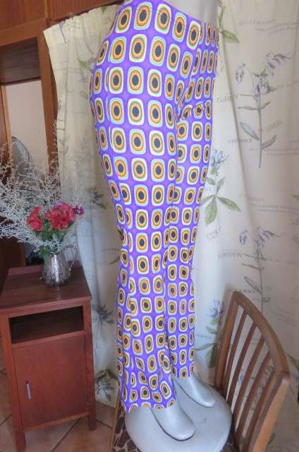 Eyecatching bootlegged polyester stretch pants size 34 to 36 in purple with orange, black+turquoise