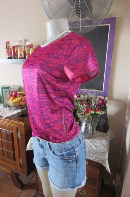 Sports top in size 30/6 by 'Maxed'. In royal blue and magenta pink vertical print. Capped sleeves.