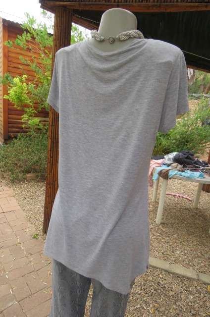 Pretty long slivergrey short sleeve T-shirt with scooped neckline size 36 to 38 by `Woolworths`.