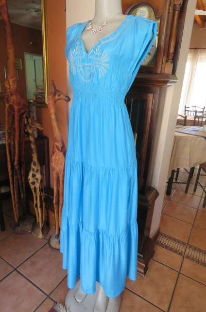 Beautiful light turquoise maxi dress with cream embroidered front and tiered skirt.Size 32/8.As new
