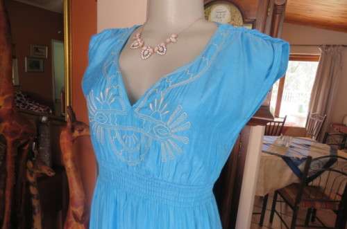 Beautiful light turquoise maxi dress with cream embroidered front and tiered skirt.Size 32/8.As new