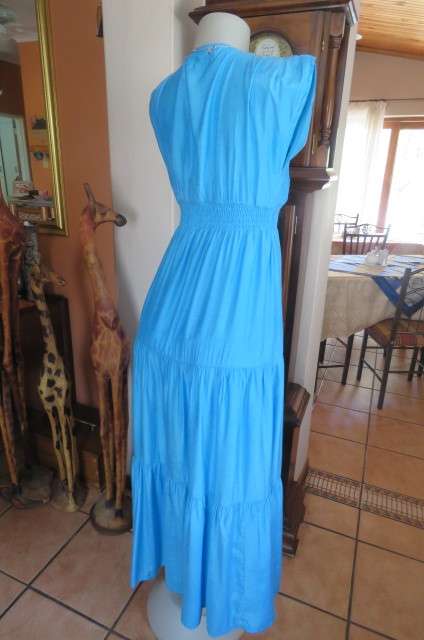 Beautiful light turquoise maxi dress with cream embroidered front and tiered skirt.Size 32/8.As new