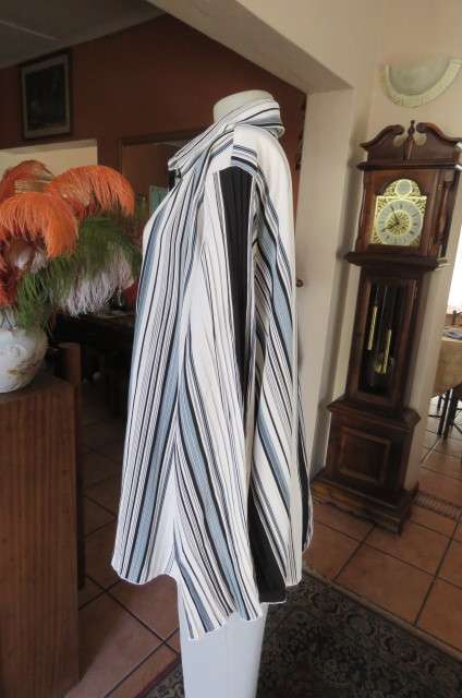 'Donatella' vertical striped long sleeve top in size 48/24 with some permanent pleats.