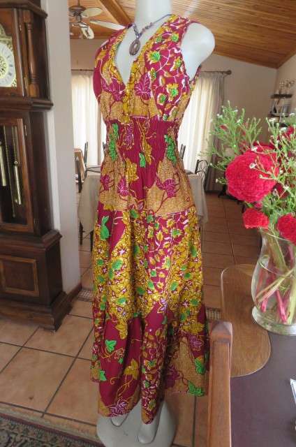Stunning maxi dress in mustard, maroon and green ethnic design size 38/14. Wide elasticcated waist.
