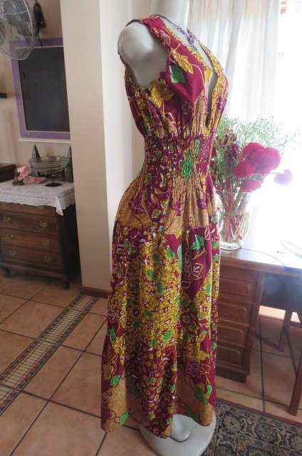 Stunning maxi dress in mustard, maroon and green ethnic design size 38/14. Wide elasticcated waist.