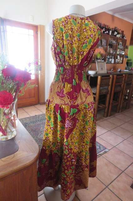 Stunning maxi dress in mustard, maroon and green ethnic design size 38/14. Wide elasticcated waist.