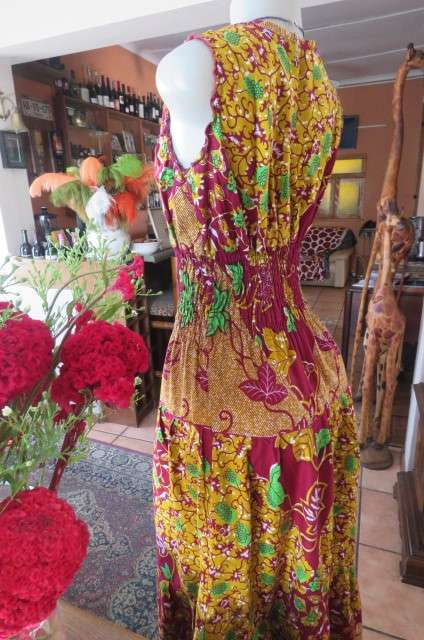 Stunning maxi dress in mustard, maroon and green ethnic design size 38/14. Wide elasticcated waist.