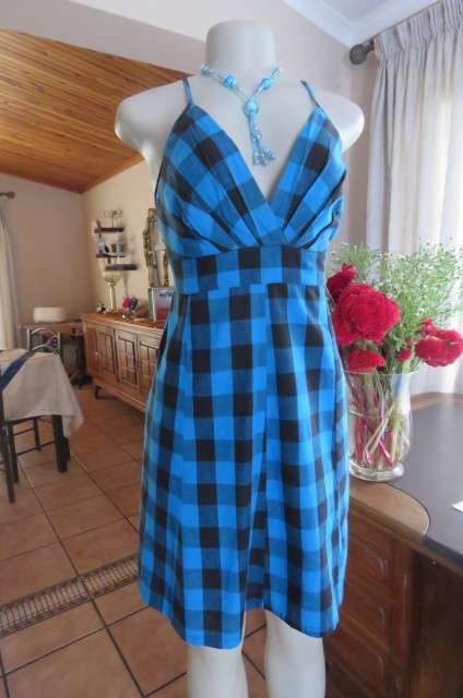 Cute blue and black check strappy dress by 'Legit' in size 40/16. Adjustable straps. Panelled front.