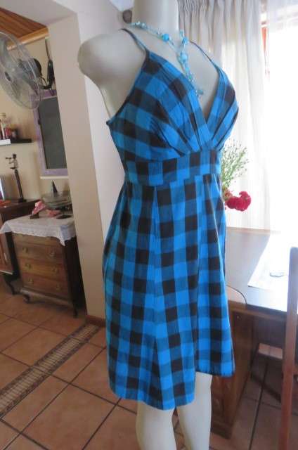 Cute blue and black check strappy dress by 'Legit' in size 40/16. Adjustable straps. Panelled front.
