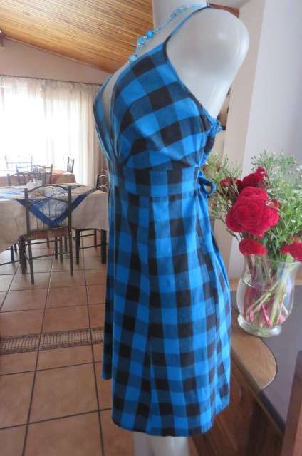 Cute blue and black check strappy dress by 'Legit' in size 40/16. Adjustable straps. Panelled front.