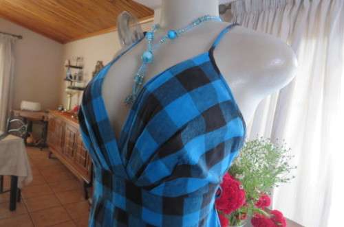 Cute blue and black check strappy dress by 'Legit' in size 40/16. Adjustable straps. Panelled front.
