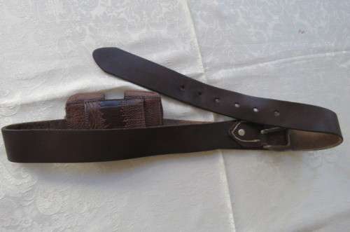Genuine leather brown belt with holder. Length 108 cm. Made in Europe. Used but in good condition.