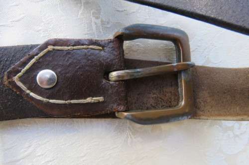 Genuine leather brown belt with holder. Length 108 cm. Made in Europe. Used but in good condition.