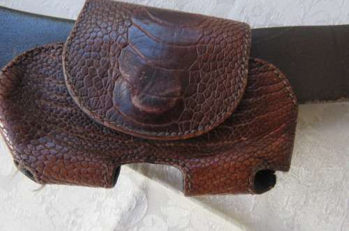 Genuine leather brown belt with holder. Length 108 cm. Made in Europe. Used but in good condition.